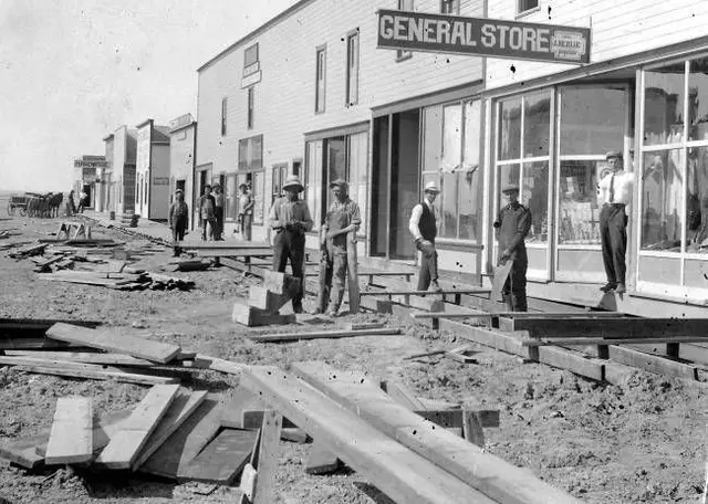 Men building wooden sidewalks on Main Street