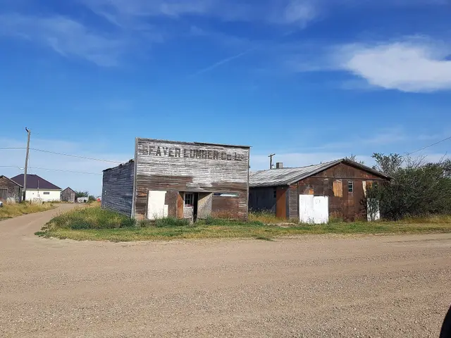 Old Beaver Lumber Co. building on a gravel street